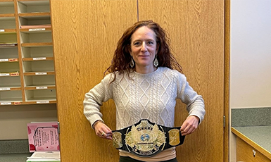  Ms. Rogers displays her championship belt.